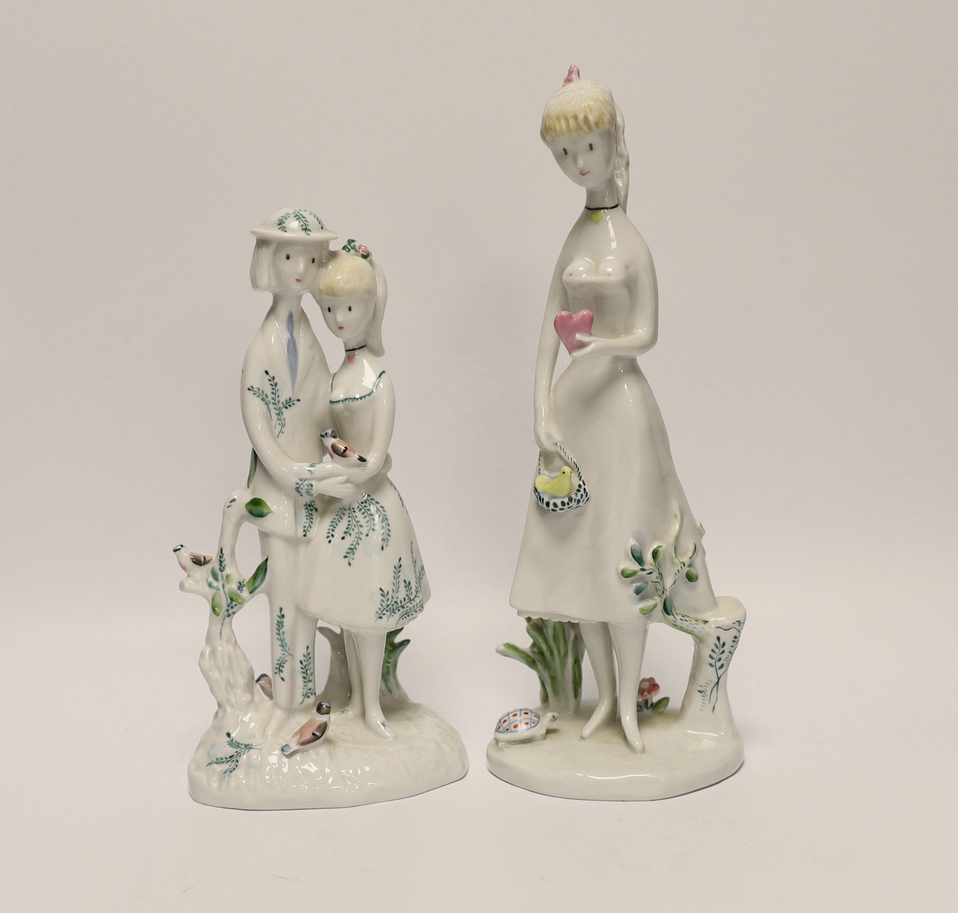Two Rosenthal figures, a girl holding a heart and a figure group with a bird, tallest 26.5cm
